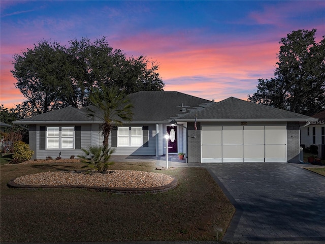 ranch-style house featuring a garage