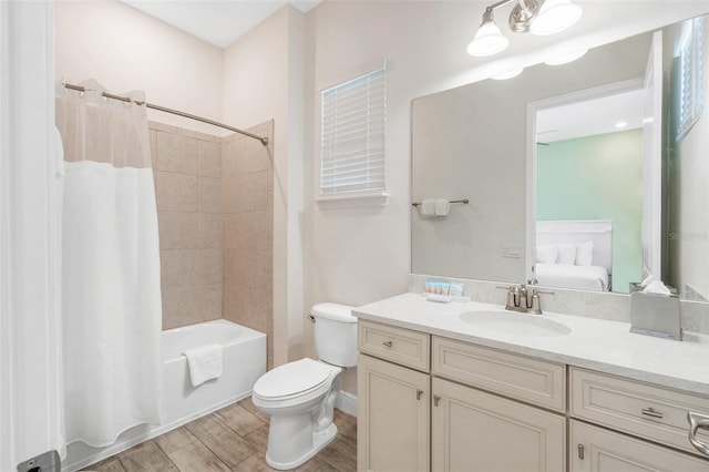 full bathroom with vanity, shower / bath combination with curtain, and toilet