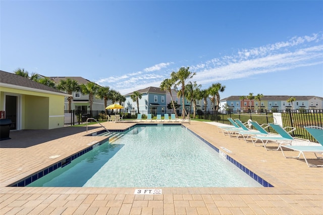 view of swimming pool with a patio