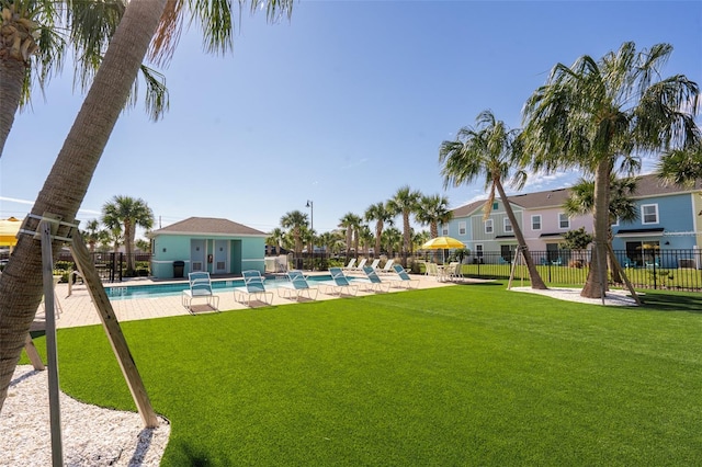 view of yard with a community pool and a patio