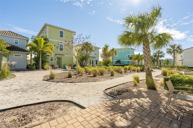 view of home's community with a patio area