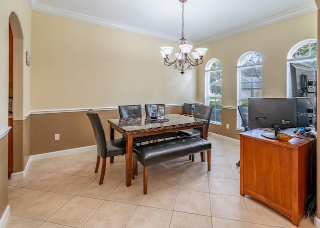 dining area featuring ornamental molding, light tile patterned floors, and an inviting chandelier