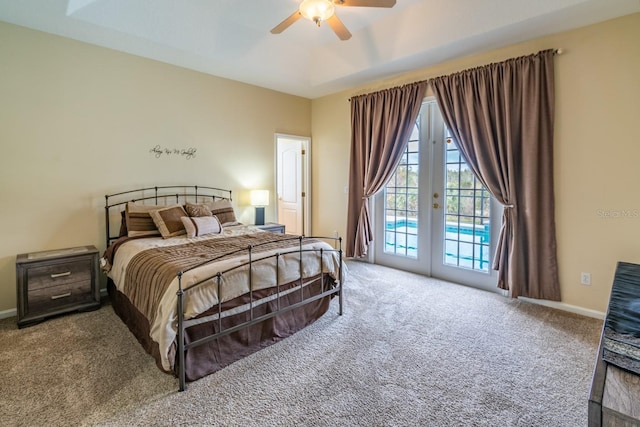 carpeted bedroom featuring french doors, ceiling fan, and access to outside