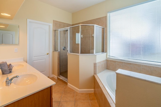 bathroom featuring tile patterned floors, plus walk in shower, and vanity