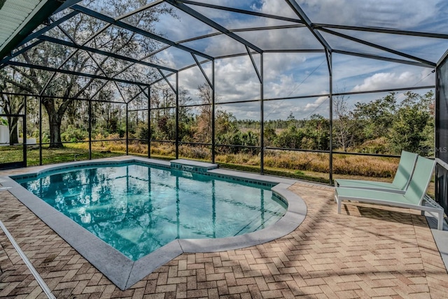 view of pool featuring a lanai and a patio area