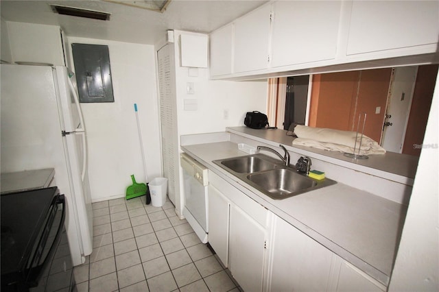 kitchen with white cabinetry, sink, light tile patterned flooring, and white appliances