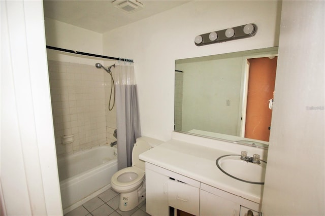 full bathroom featuring tile patterned flooring, vanity, toilet, and tiled shower / bath