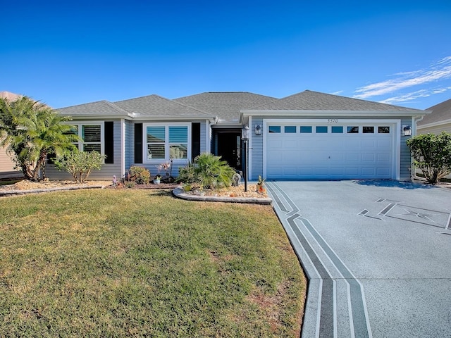 ranch-style house with a garage and a front yard