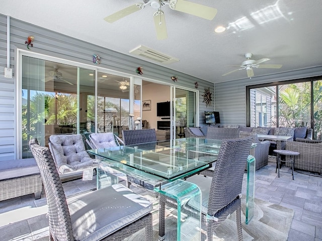 view of patio / terrace featuring an outdoor living space and ceiling fan