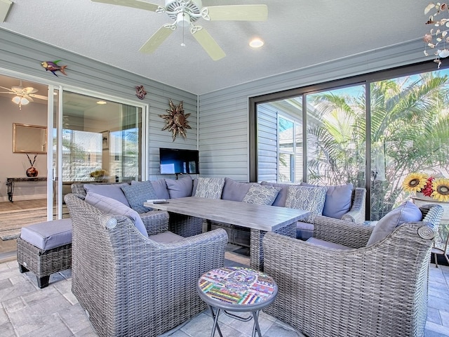 view of patio featuring an outdoor hangout area and ceiling fan