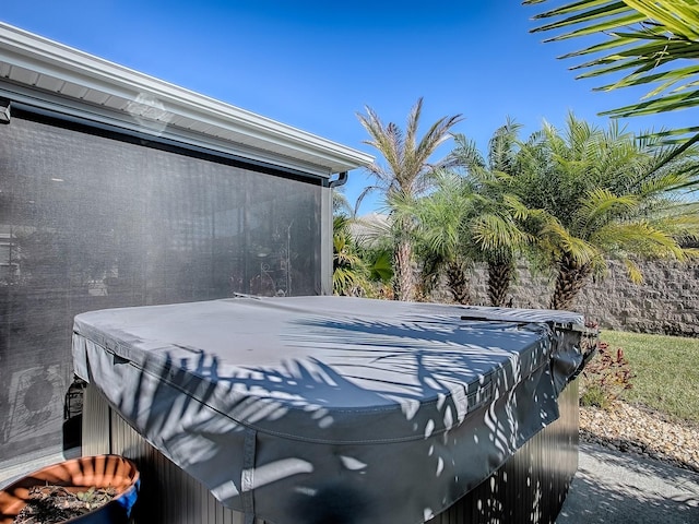 view of patio / terrace with a hot tub