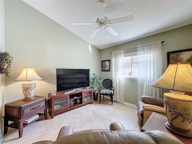 living room featuring ceiling fan, lofted ceiling, a textured ceiling, and light tile patterned floors