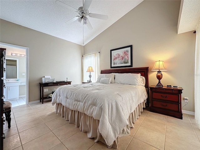 bedroom featuring light tile patterned flooring, lofted ceiling, and a textured ceiling