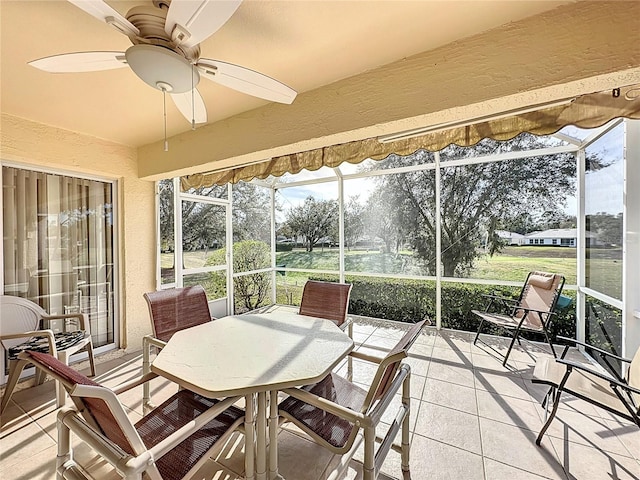 sunroom / solarium with ceiling fan