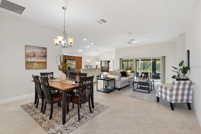 tiled dining room with ceiling fan with notable chandelier and vaulted ceiling