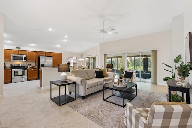 living room with ceiling fan, vaulted ceiling, and light tile patterned floors