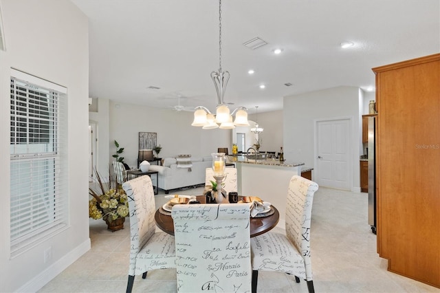 dining space with a chandelier