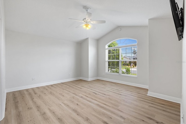 unfurnished room featuring ceiling fan, lofted ceiling, and light wood-type flooring