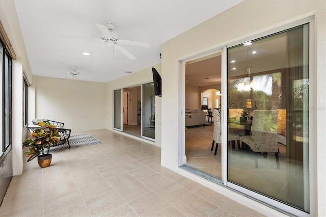 sunroom / solarium with ceiling fan