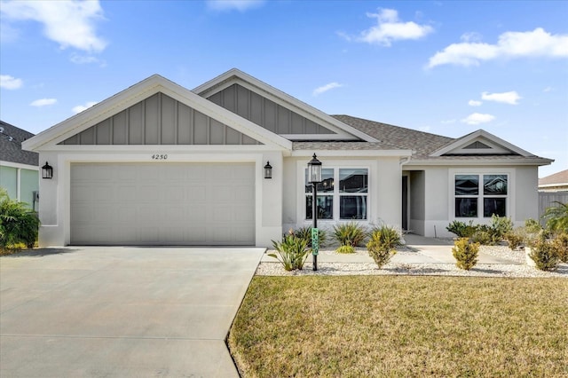 view of front of home featuring a garage and a front yard