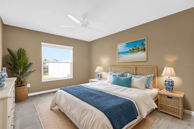 bedroom with light tile patterned floors and ceiling fan