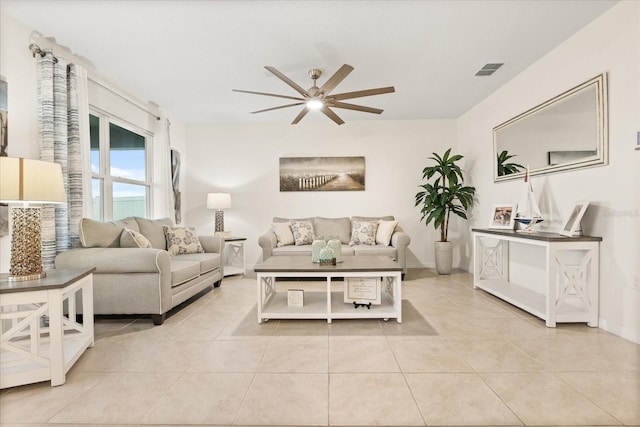 tiled living room with ceiling fan