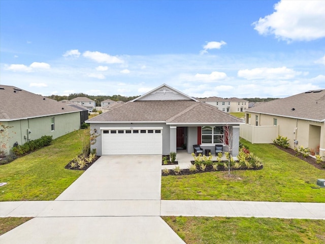 ranch-style home with a garage, covered porch, and a front lawn