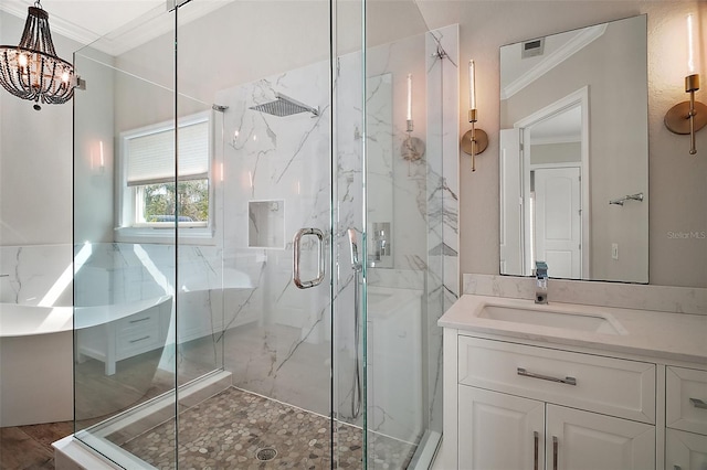 bathroom featuring a chandelier, a marble finish shower, vanity, and crown molding