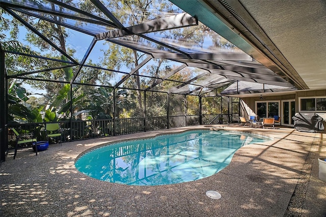 view of pool featuring a lanai and a patio area