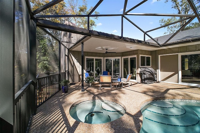 unfurnished sunroom with a healthy amount of sunlight and a jacuzzi