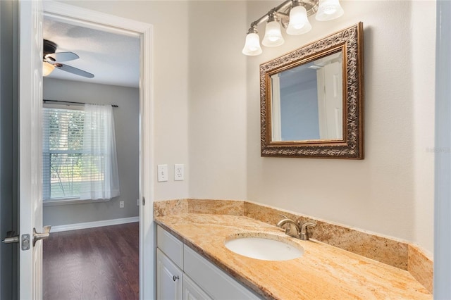 bathroom with vanity, wood-type flooring, and ceiling fan