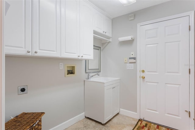 laundry area with sink, cabinets, washer hookup, light tile patterned floors, and hookup for an electric dryer