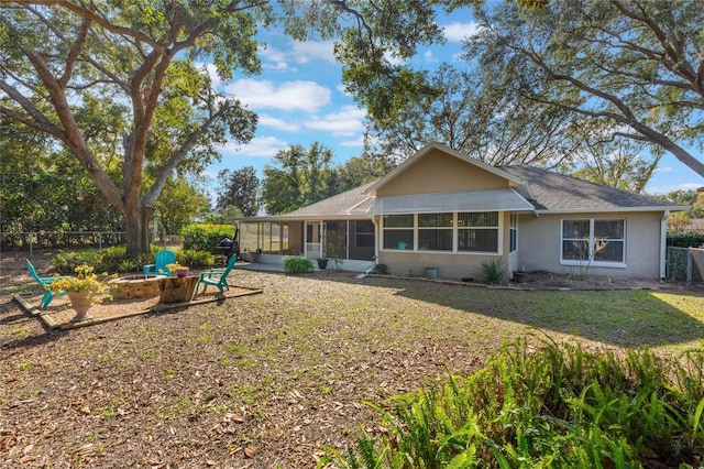 back of house with a sunroom