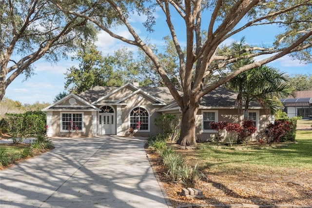 ranch-style home with a front yard