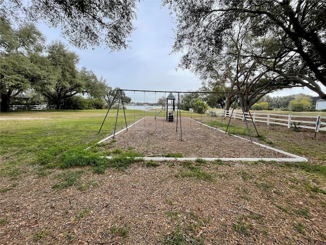 view of playground featuring a yard