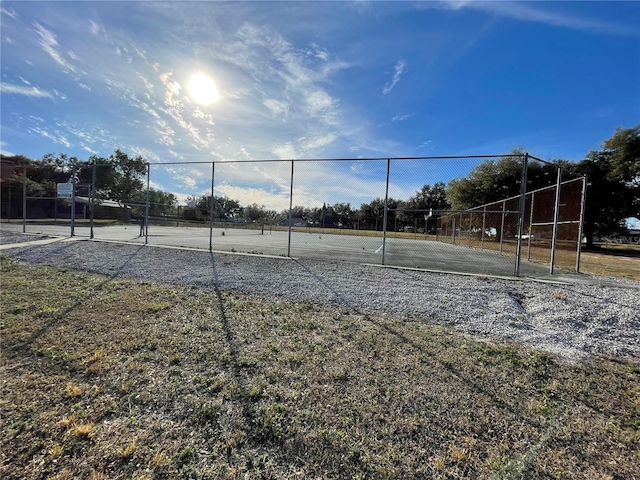 exterior space with tennis court