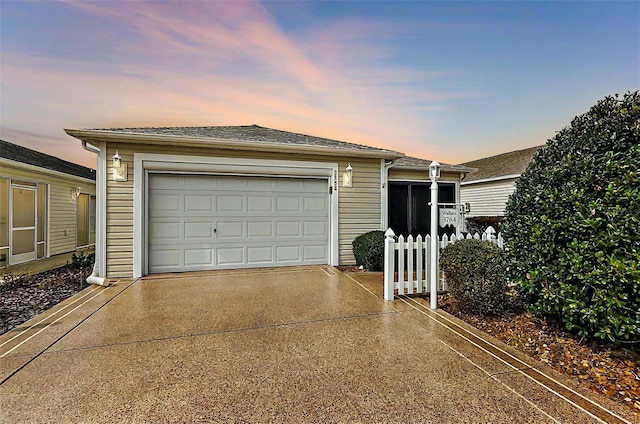 view of front facade featuring a garage and an outdoor structure