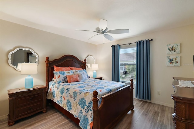 bedroom featuring hardwood / wood-style flooring and ceiling fan