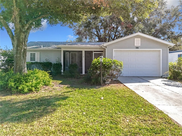 ranch-style home featuring a garage and a front lawn