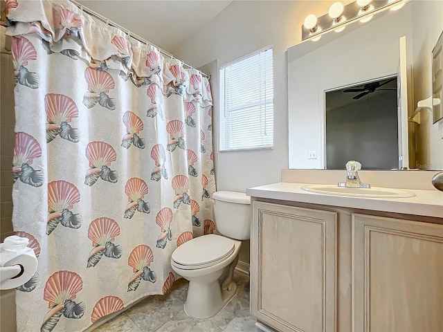 bathroom featuring a shower with curtain, vanity, and toilet