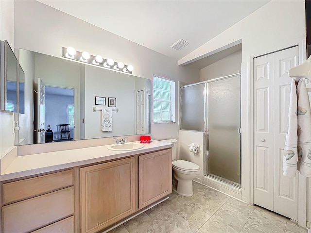 bathroom featuring walk in shower, lofted ceiling, vanity, and toilet