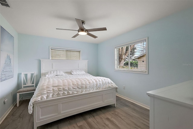 bedroom with hardwood / wood-style flooring and ceiling fan