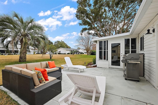 view of patio with area for grilling and outdoor lounge area