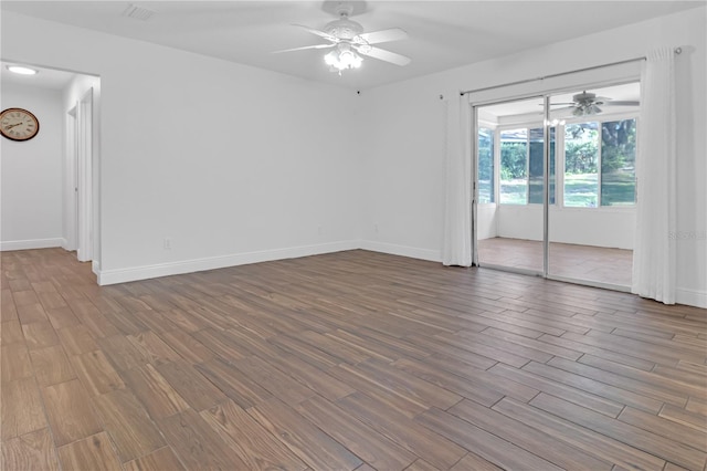 empty room featuring hardwood / wood-style flooring and ceiling fan