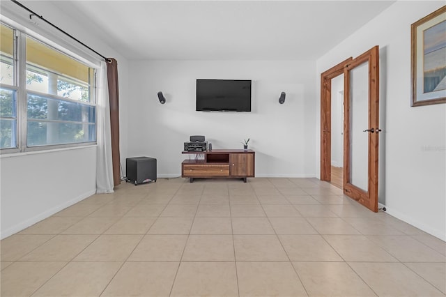 unfurnished living room featuring light tile patterned flooring