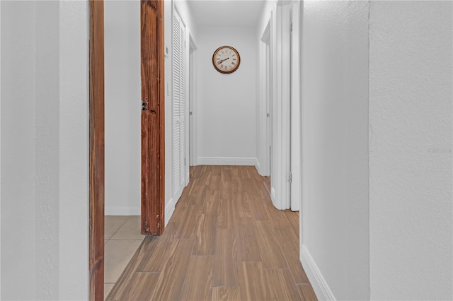 hallway with light wood-type flooring