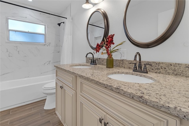 full bathroom featuring shower / tub combo, vanity, and toilet