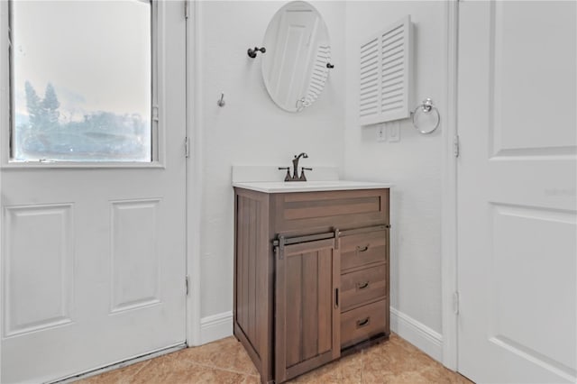 bathroom with vanity and tile patterned floors