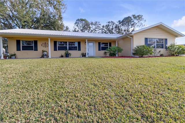 single story home with a front lawn