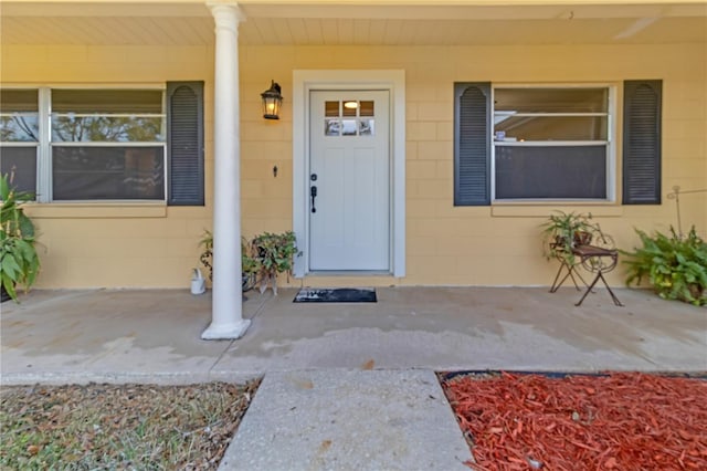 doorway to property with a porch